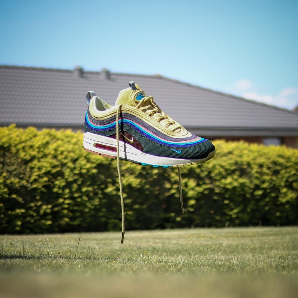 Nike Shoes: Redefining Performance, Style, and Innovation Nike sneaker floating above grass in a sunny Danish garden.