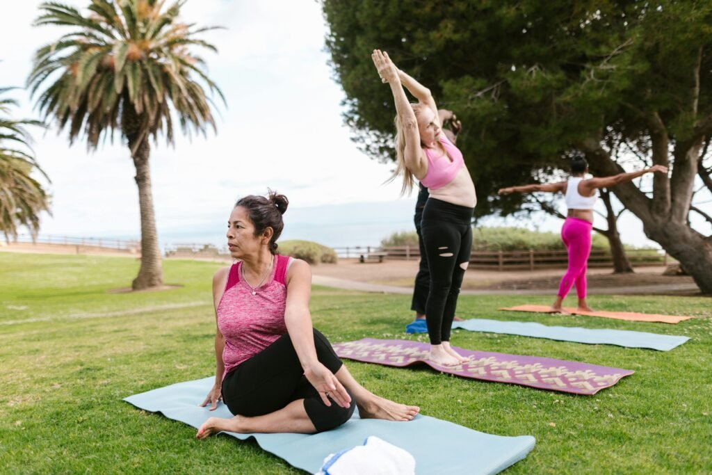 Hair Supplements Backed by Research: The Science Behind Stronger, Healthier Hair A diverse group of people practicing yoga on mats in a sunny park with palm trees.